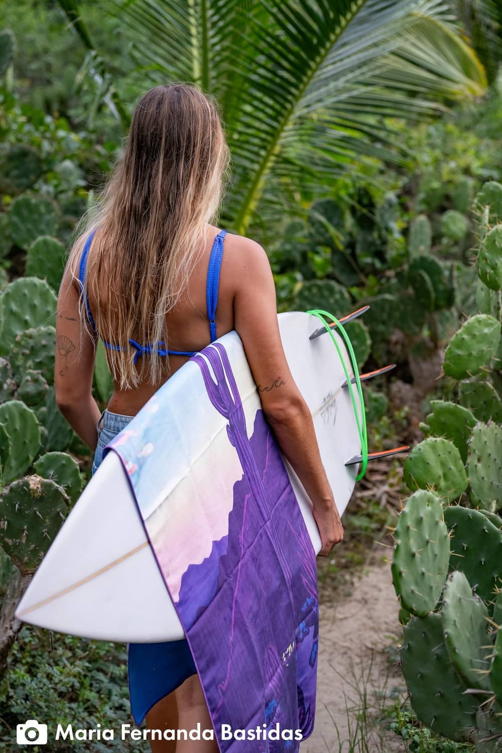 Ultralight body towel with Desert Aire print, folded with purple cactus artwork.
