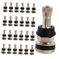 Set of brass tire valve stems with black rubber bases, multiple valve caps included