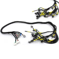 Engine wiring harness with black and yellow wires and multiple electrical connectors