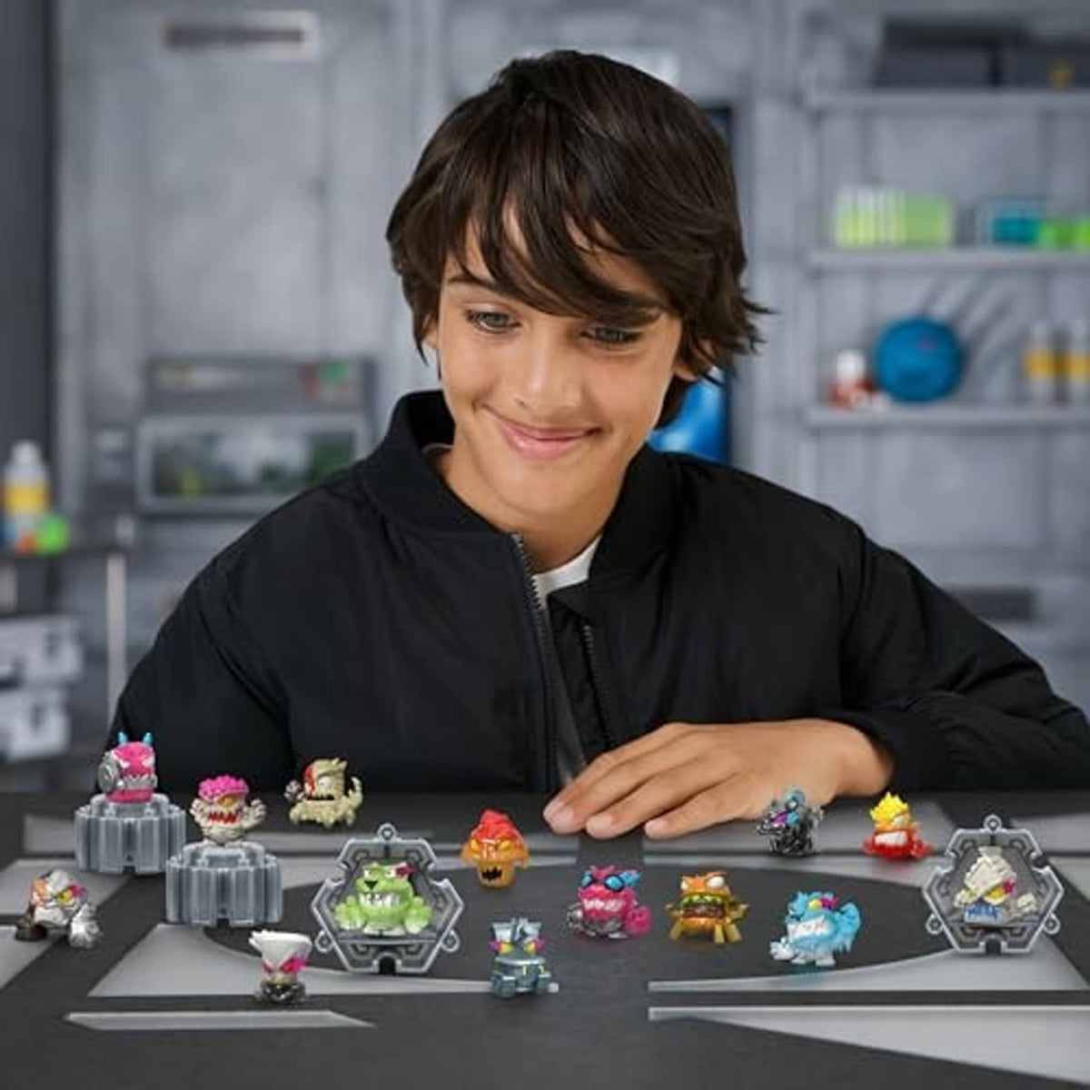 Boy arranging micro-beast collectible figures on display stands