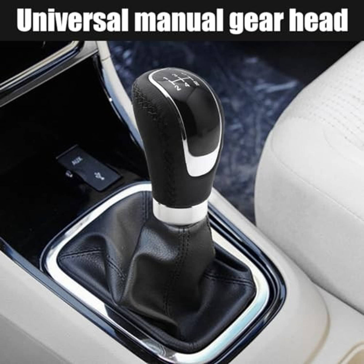Manual gear shift knob installed in a car: black leather top with silver trim and shift markings