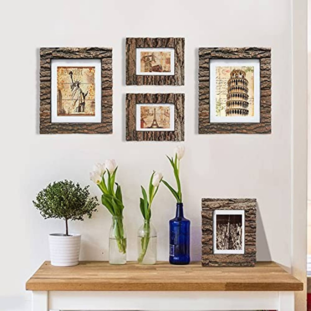 Set of rustic bark wood photo frames arranged on a mantel with small decor