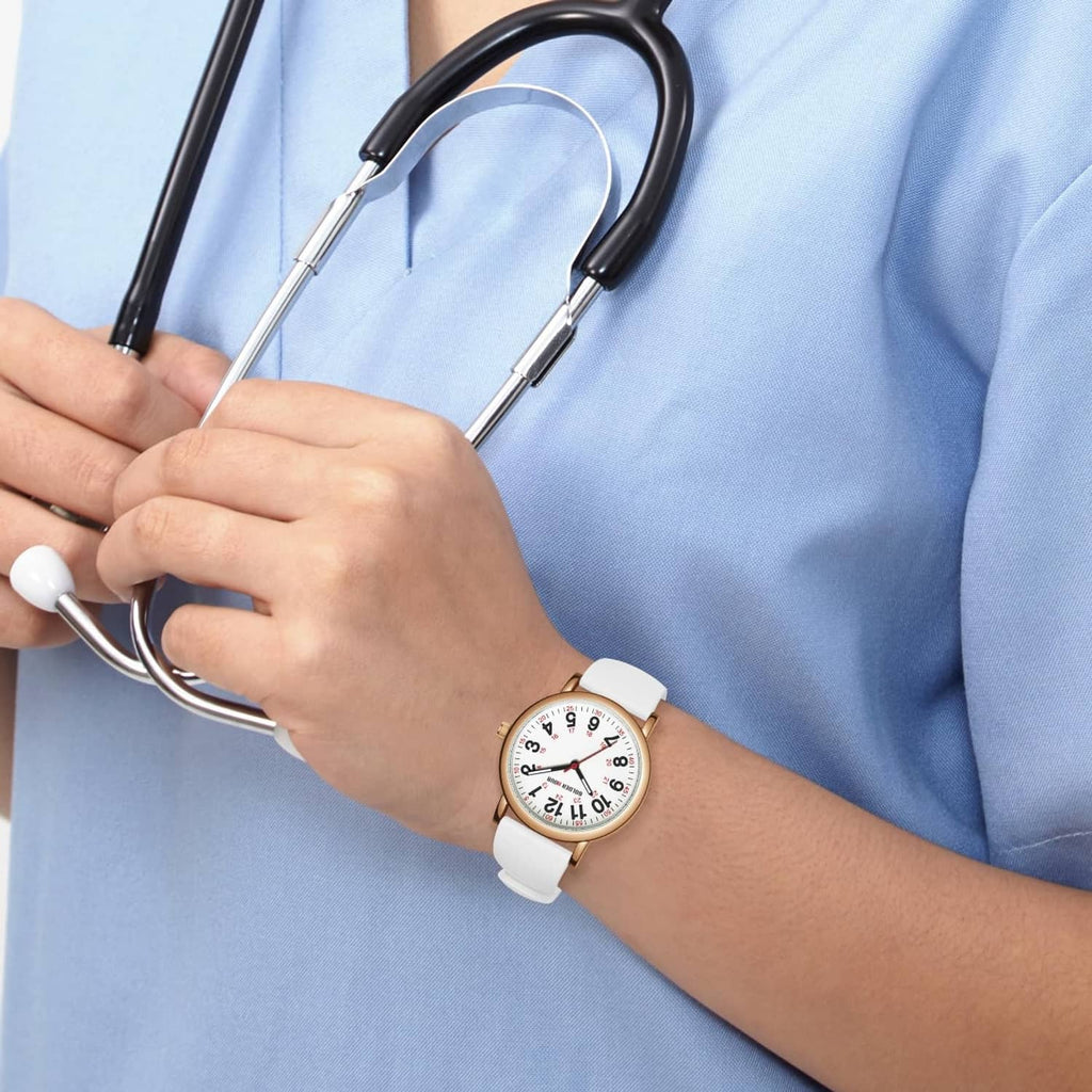 Rose gold nurse watch on wrist with white silicone band and red minute markers