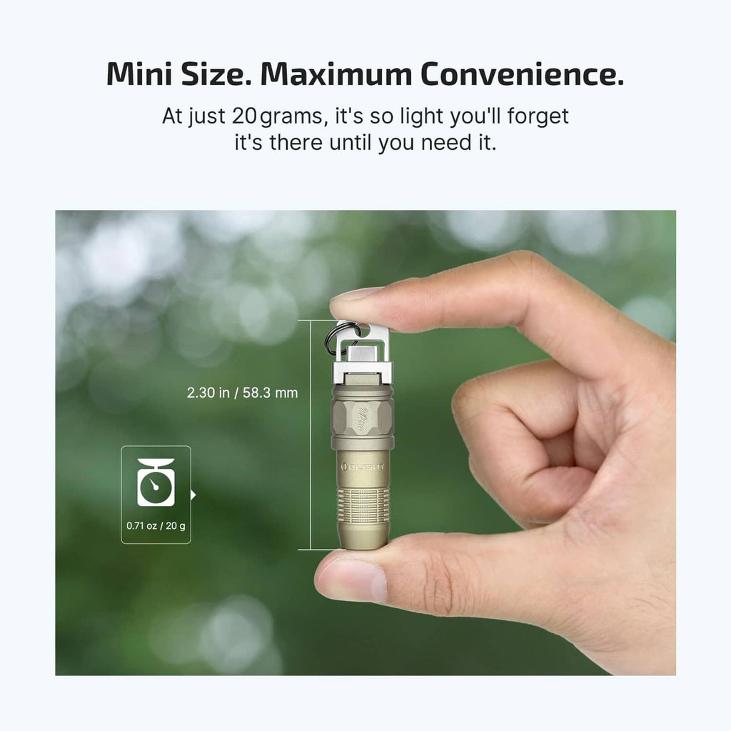 Olive green mini LED flashlight held in hand, compact size