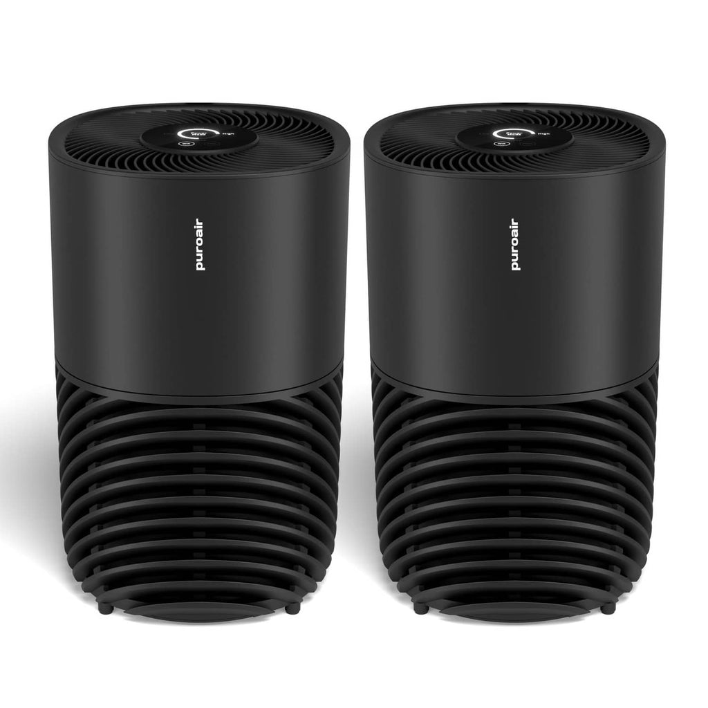 Two black air purifiers, stacked vented cylinders with top fan grille