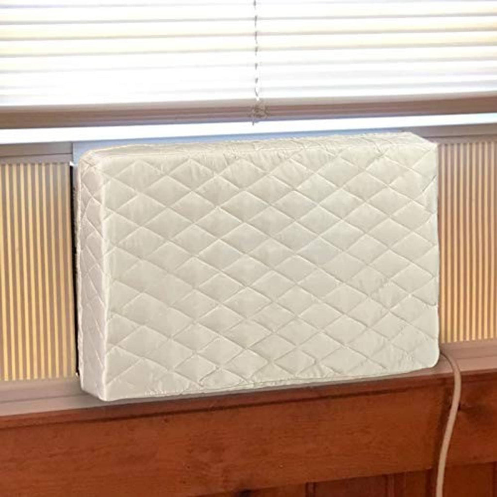 Cream quilted air conditioner cover fitted over window AC front