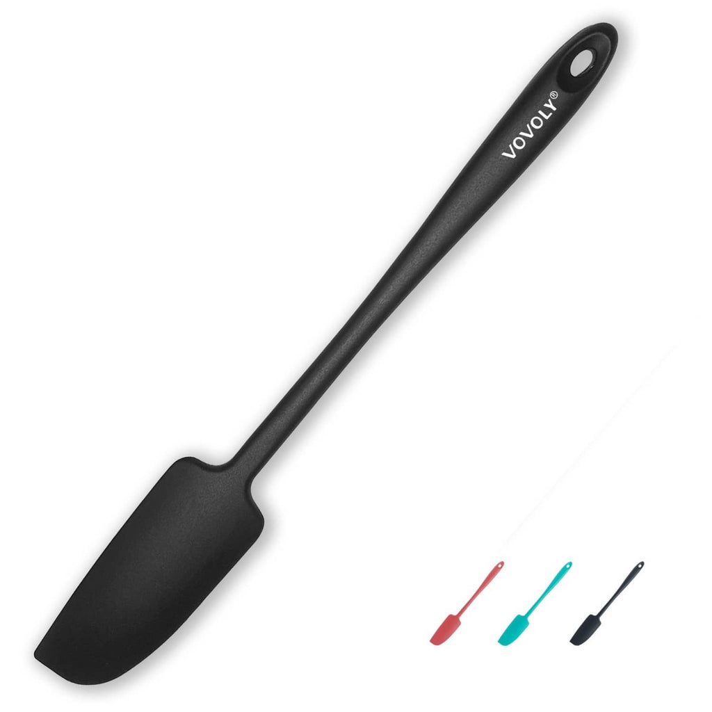 Small black silicone jar spatula with wide flat blade and hanging hole on handle