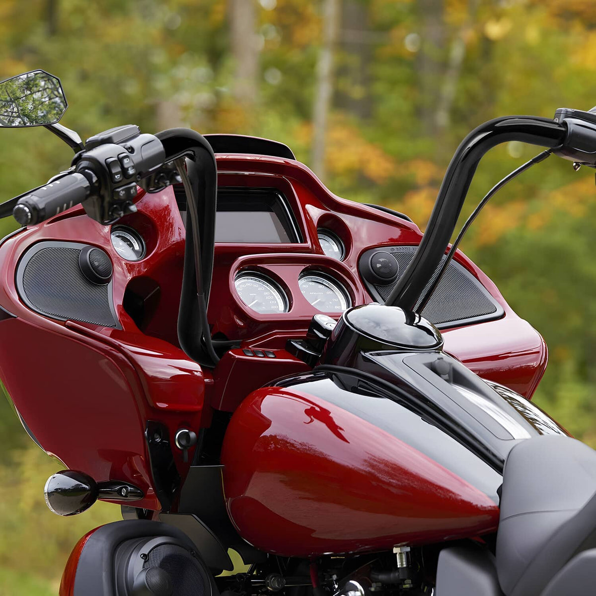 Black ape hanger handlebar installed on a red motorcycle front cockpit