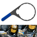 Fuel filter wrench with blue handle and large circular head, angled view.