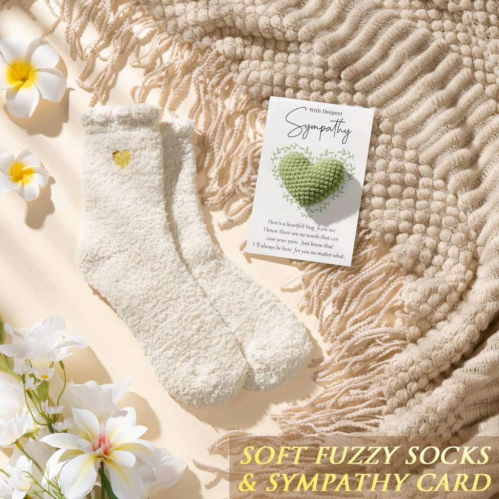 Soft fuzzy beige socks with sympathy card on textured knit fabric