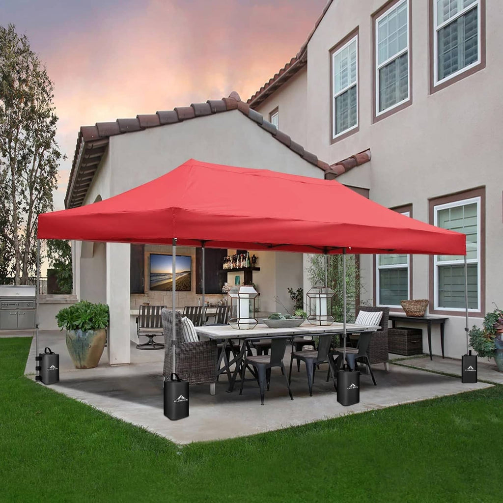 Black canopy water weight bags at corners of an outdoor patio canopy