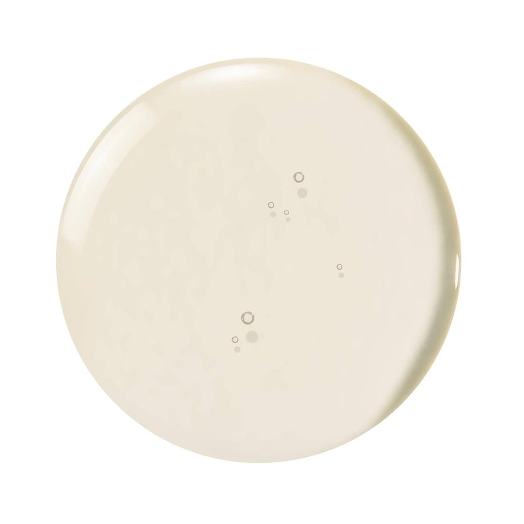 Creamy serum drop gel texture swirl in pale white, shown as a smooth circular smear