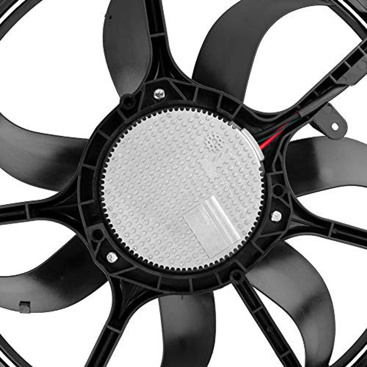 Cooling fan motor housing close-up with gray label on black fan assembly