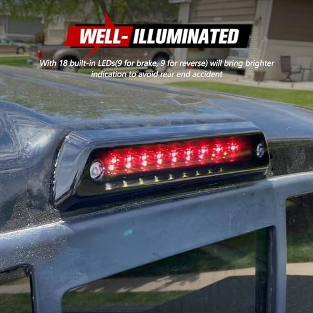 Smoked LED third brake light bar with red LEDs illuminated on truck tailgate