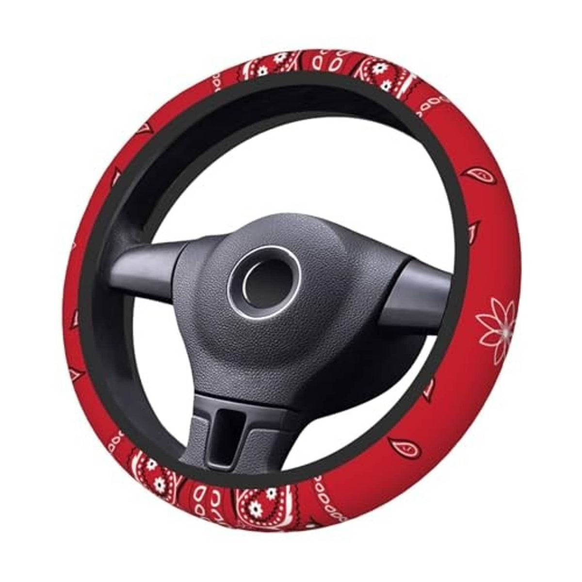 Red steering wheel cover with black trim and paisley print, on a steering wheel