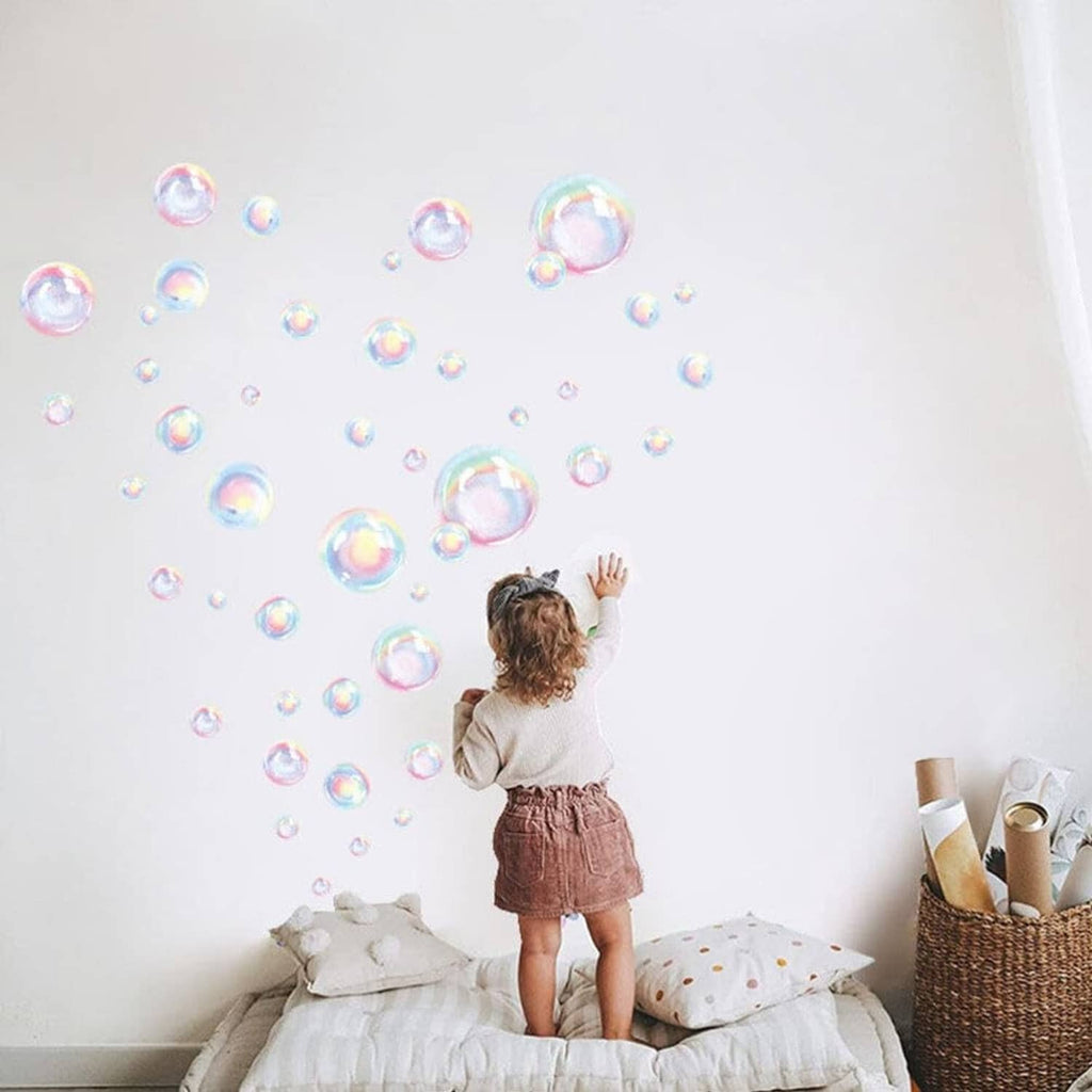 Rainbow bubble wall decals clustered overhead with iridescent bubble circles