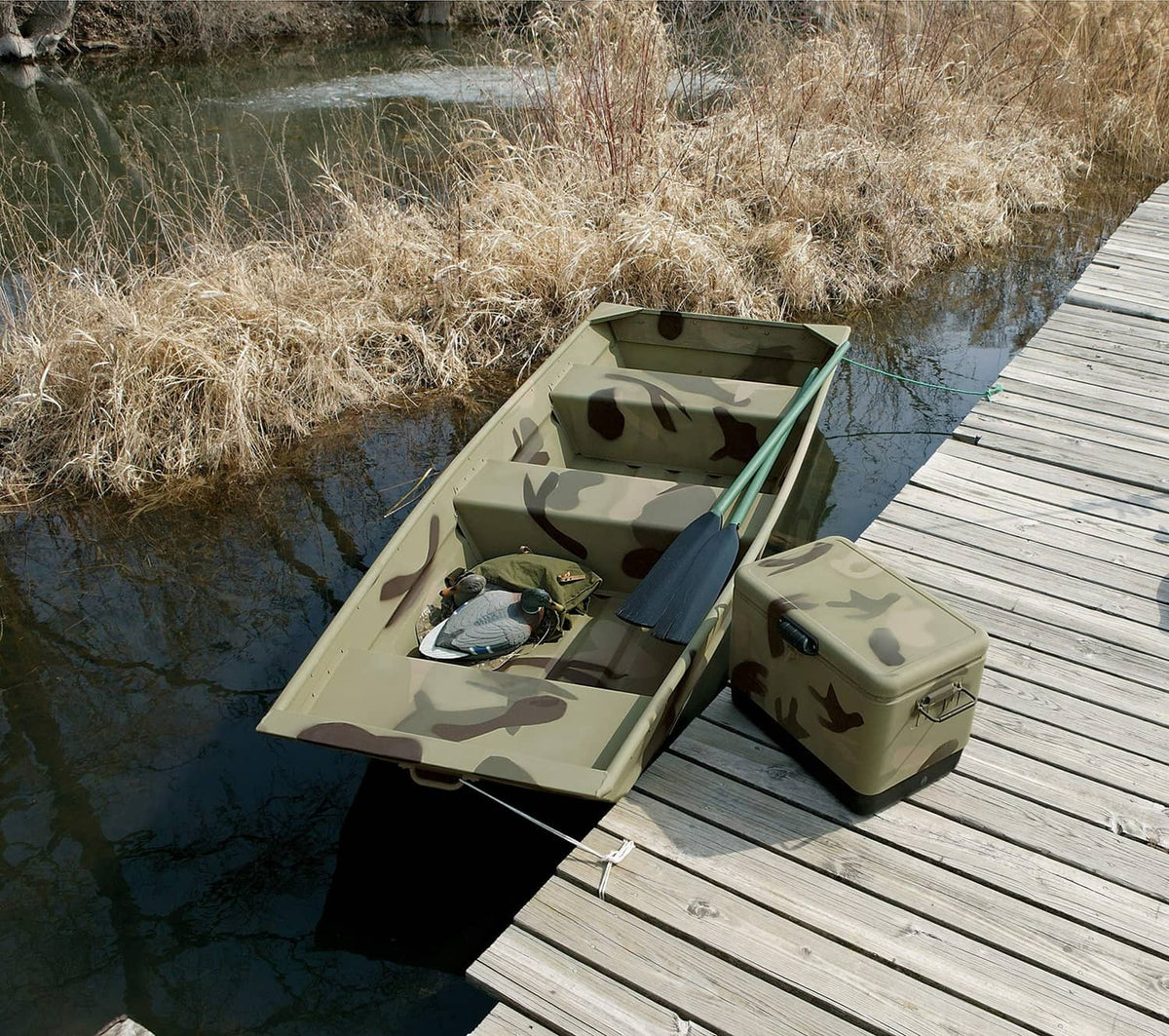 Camouflage-painted storage boxes and cooler on wooden dock