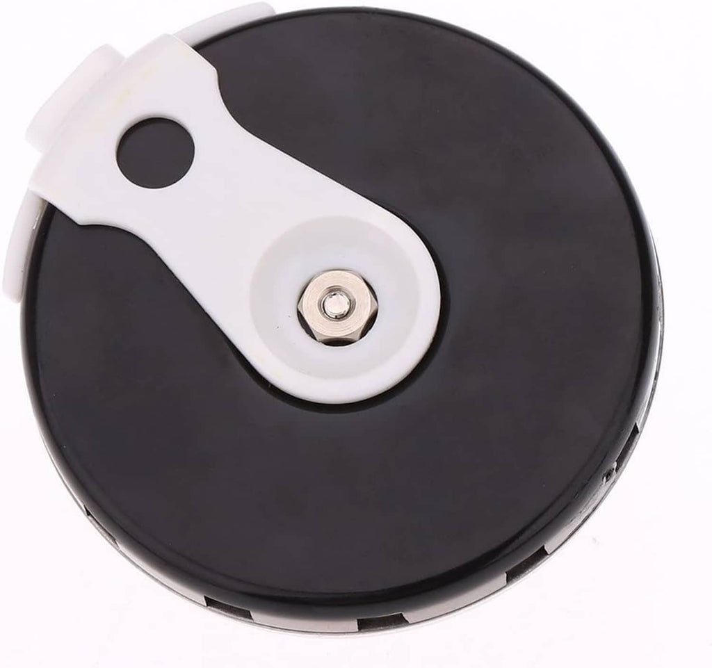 Black pitch pipe tuner with white mouthpiece tab and visible center screw