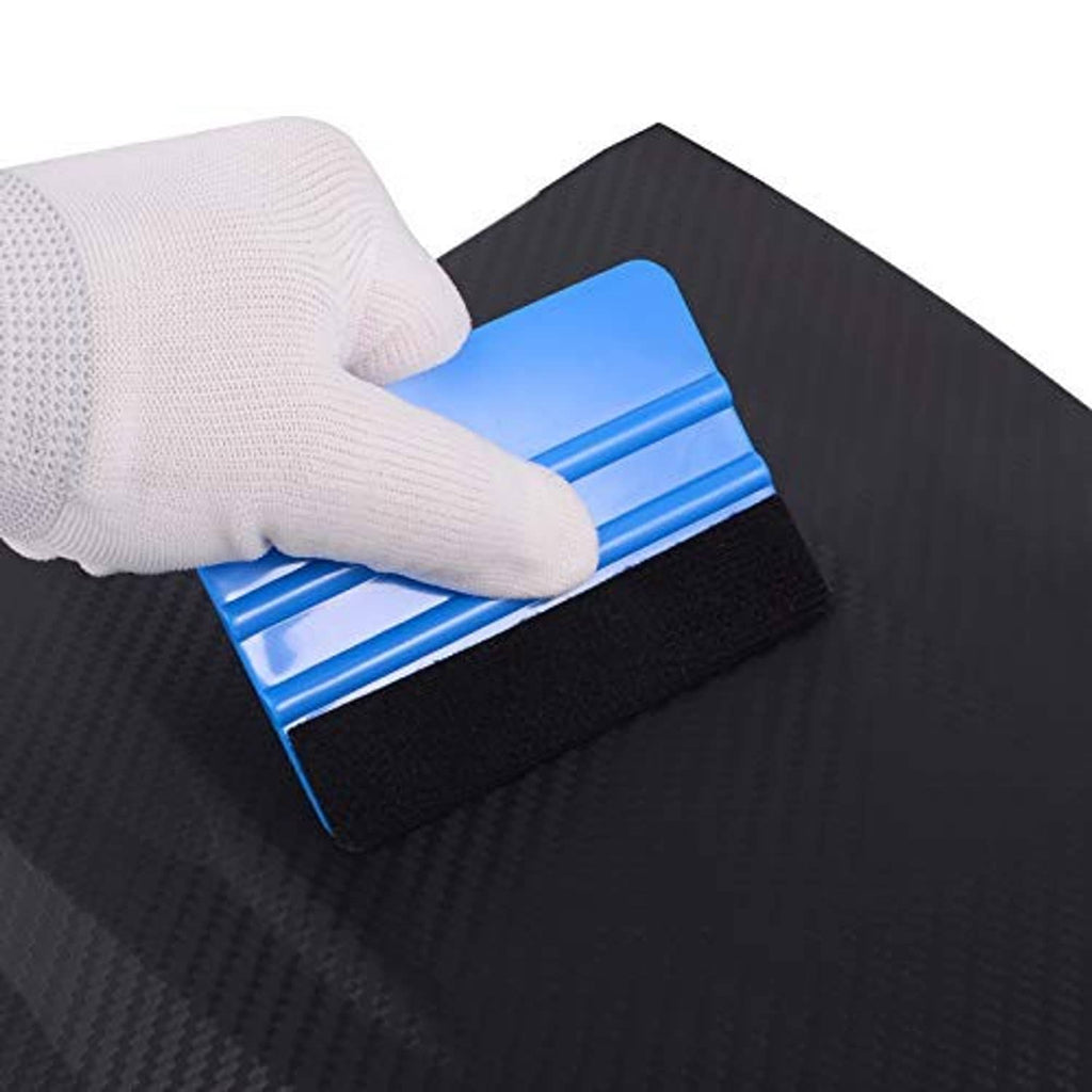 Blue vinyl squeegee with black felt edge smoothing vinyl film on a surface