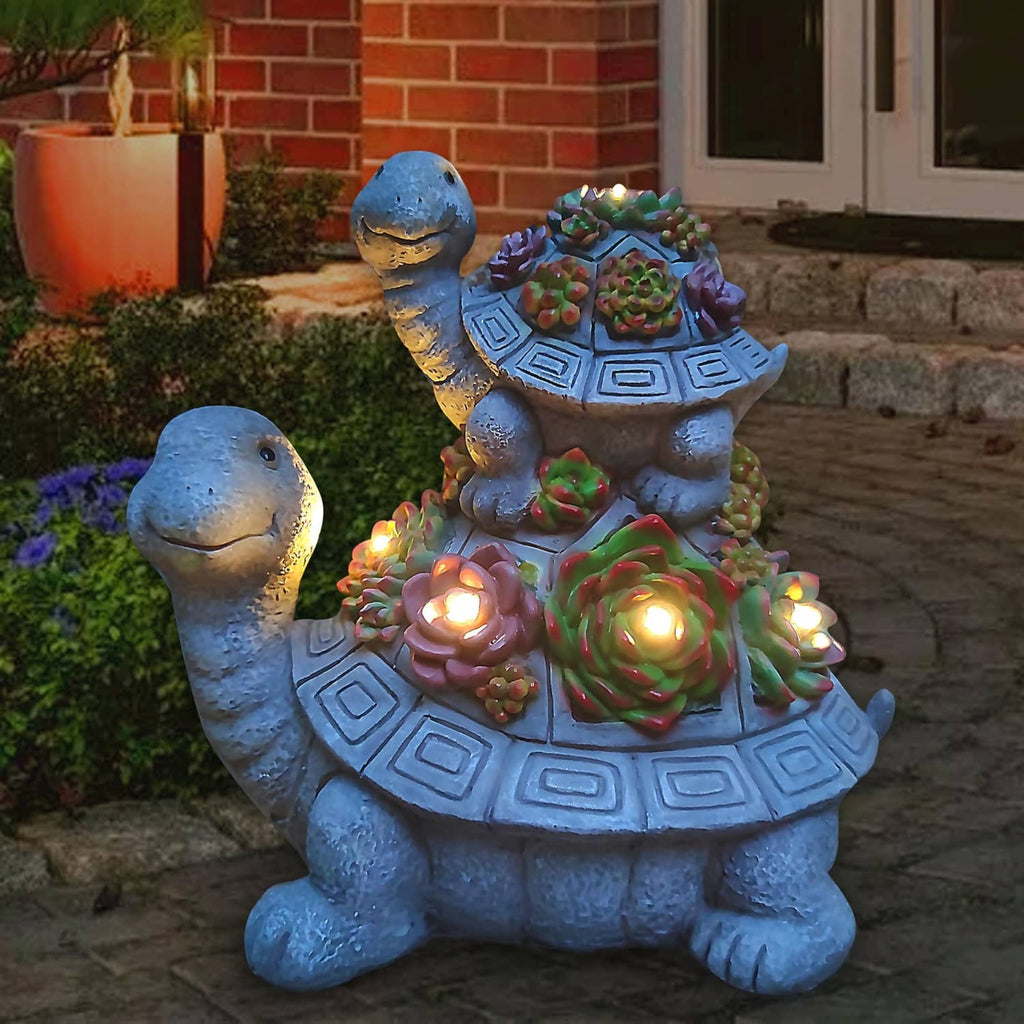 Solar tortoise garden lantern statue with multicolor flowers and warm LED lights on the shell