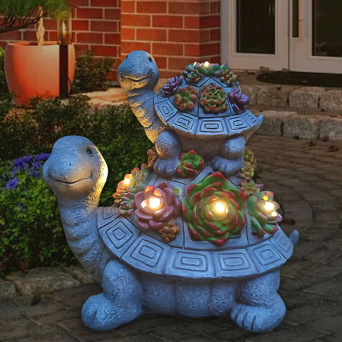Solar tortoise garden lantern statue with multicolor flowers and warm LED lights on the shell
