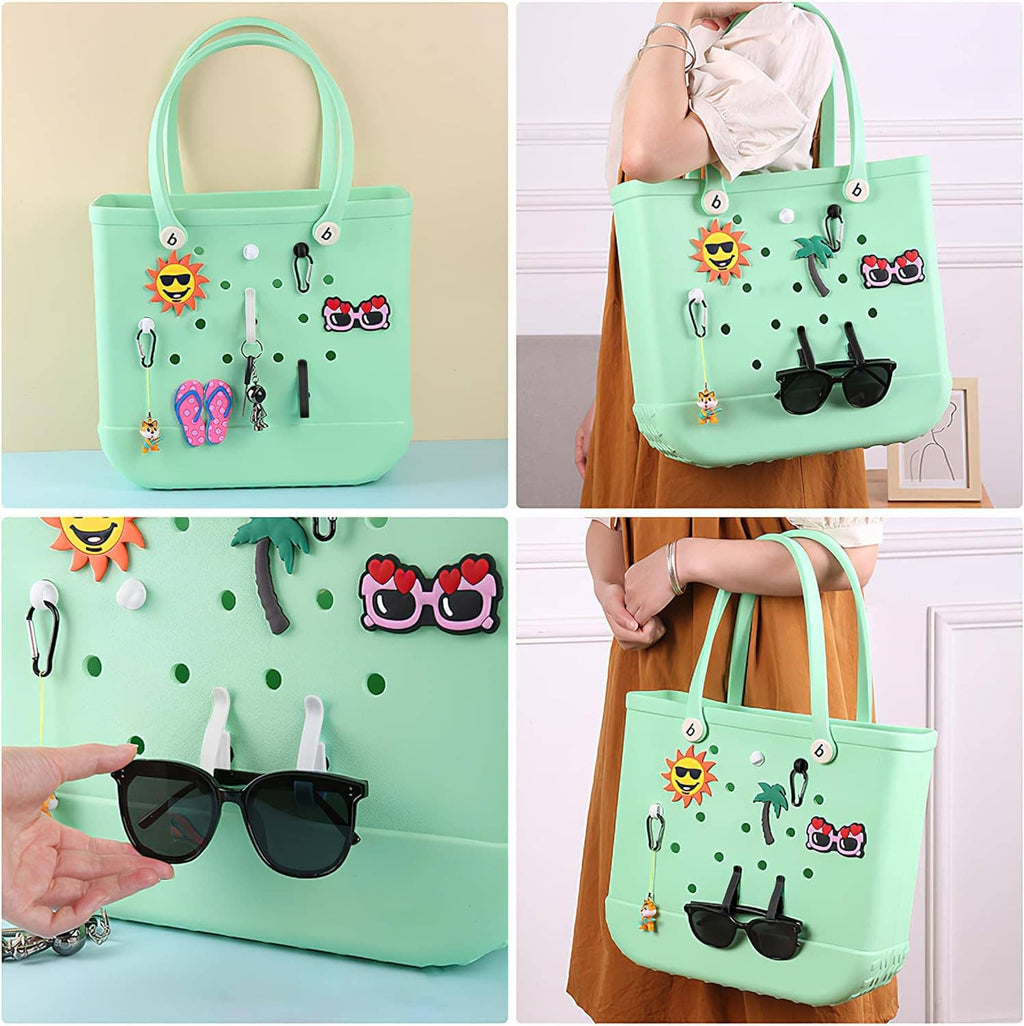 Mint green tote bag with hanging accessory hooks, sunglasses, and key holder clips