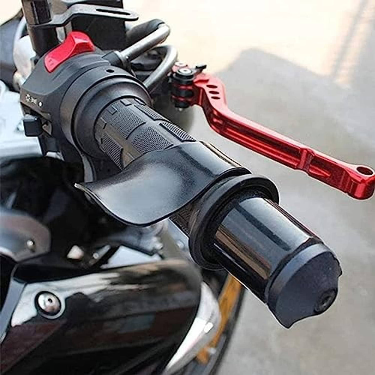 Black curved throttle assist cover on throttle grip