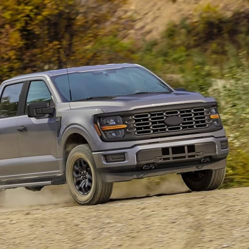 Silver pickup truck with installed front bumper grille insert and dark grille mesh panel