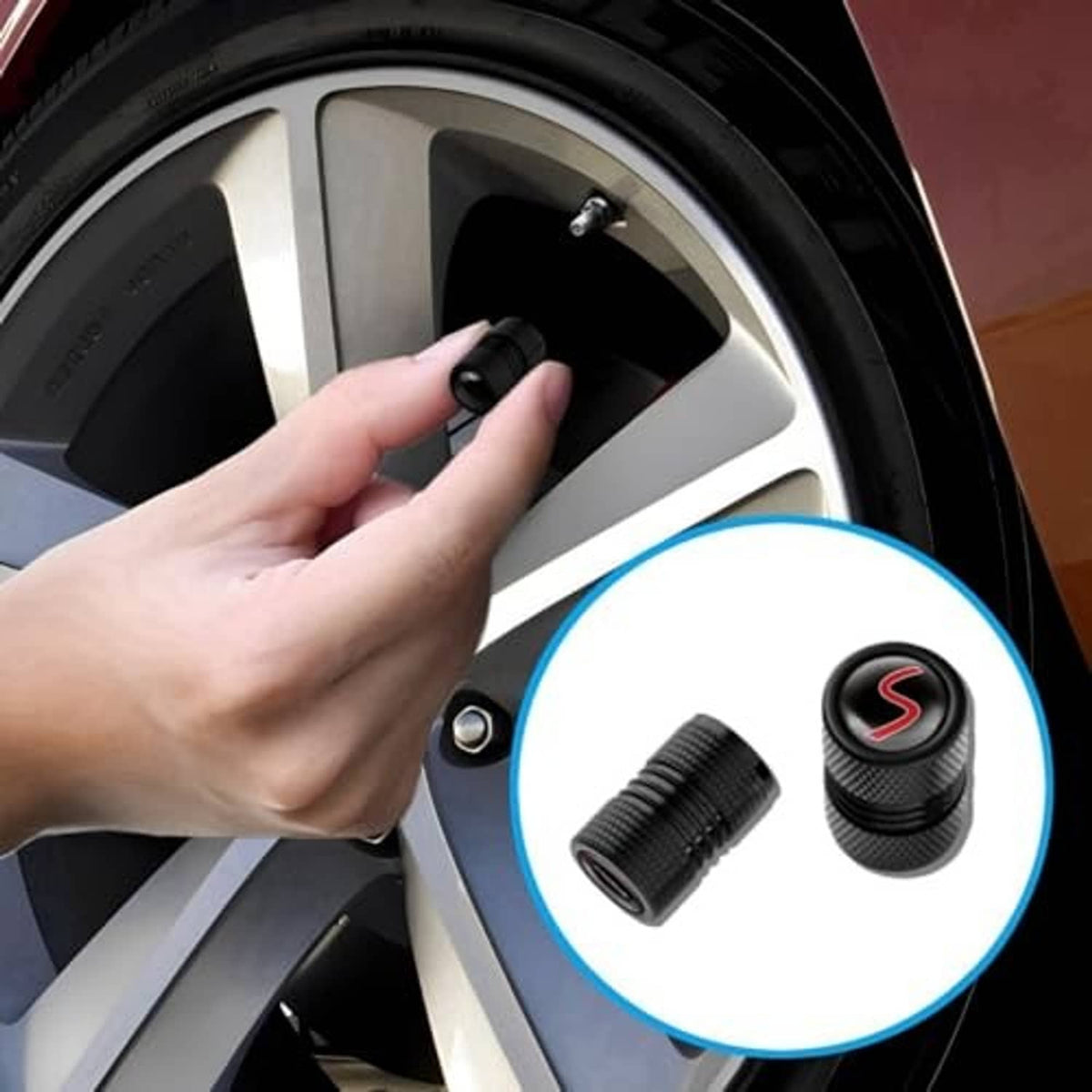 Black wheel valve cap with red S logo being installed on a car wheel