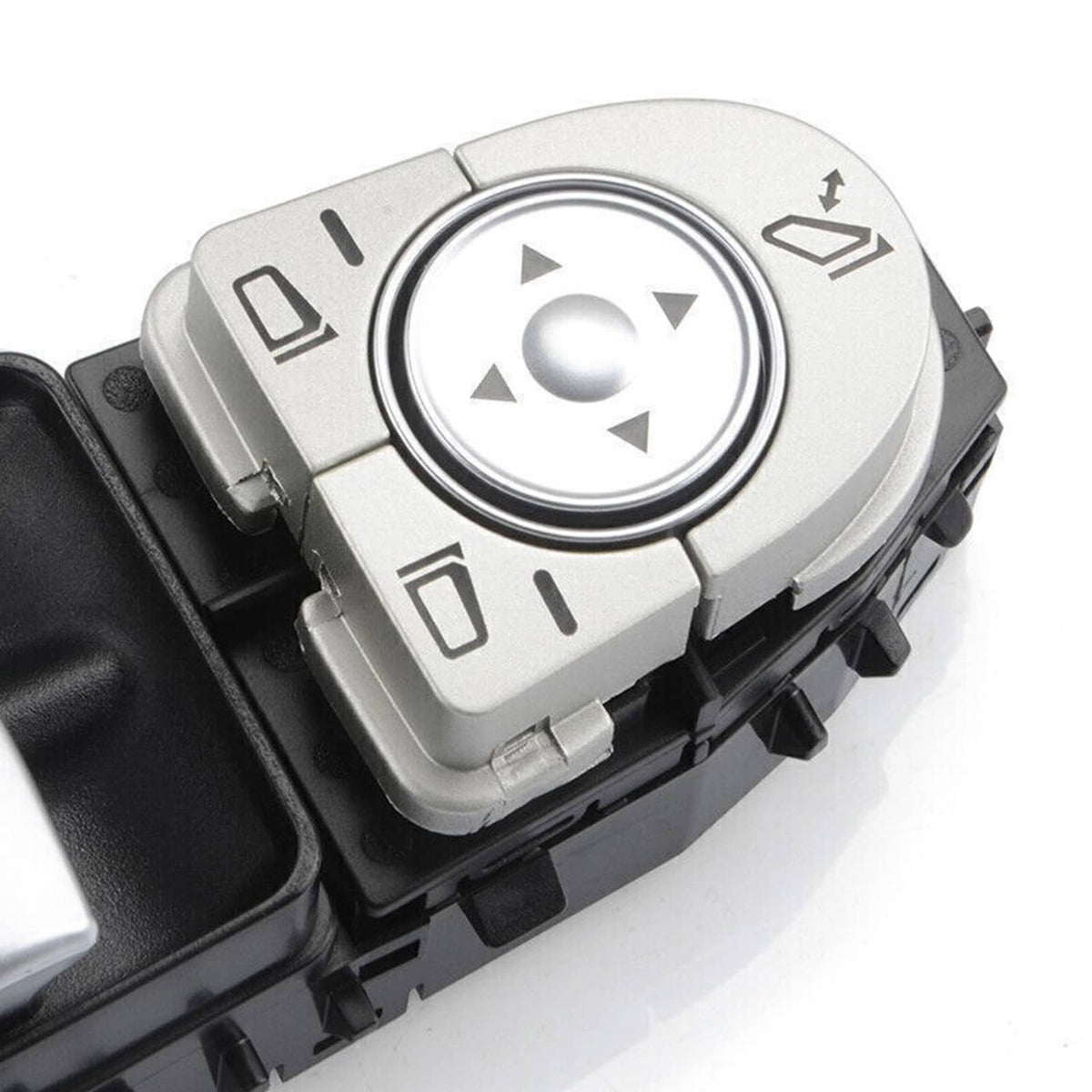 Power window master control switch close-up with silver directional button ring
