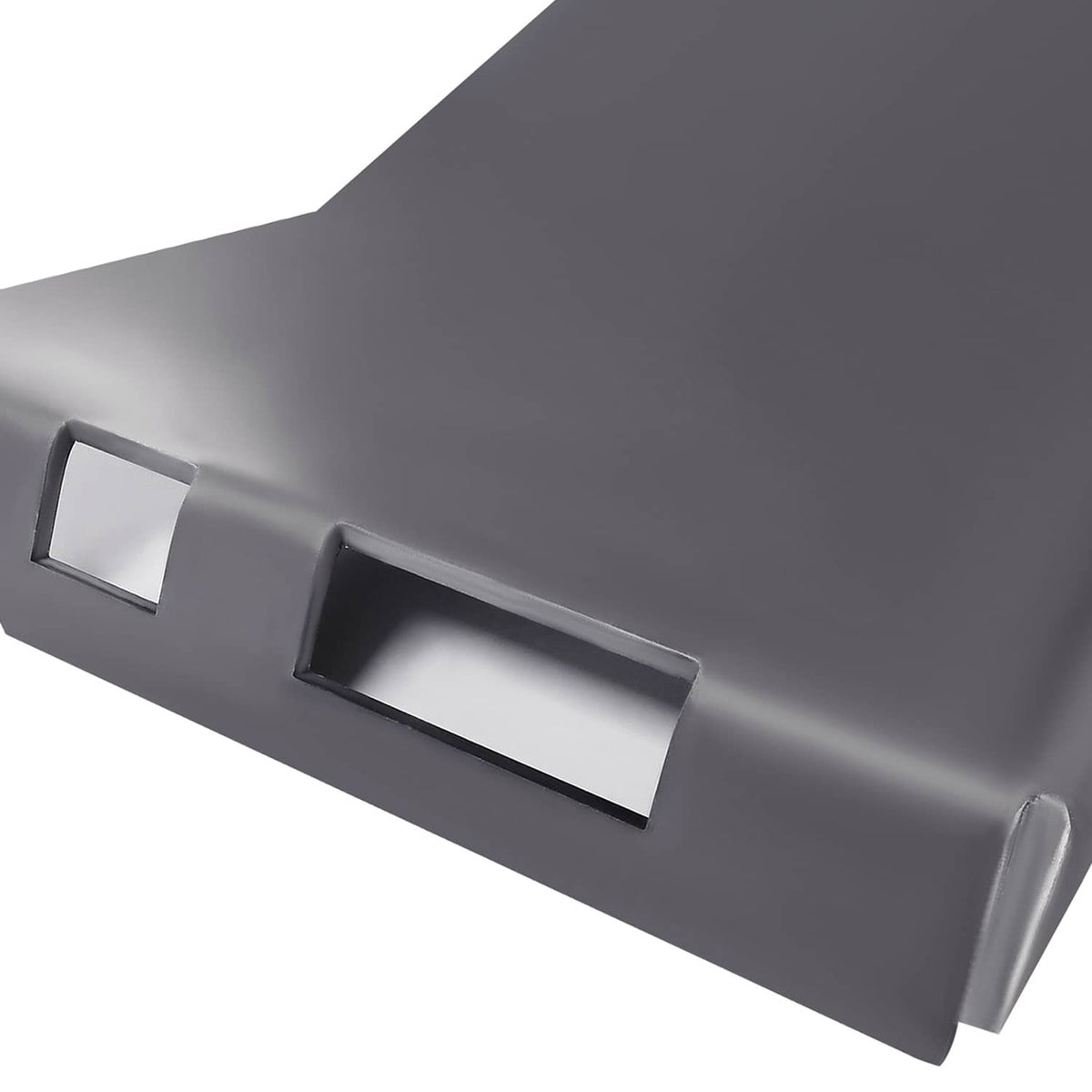 Close-up of dark metal adapter plate with rectangular slot and smooth curved edge