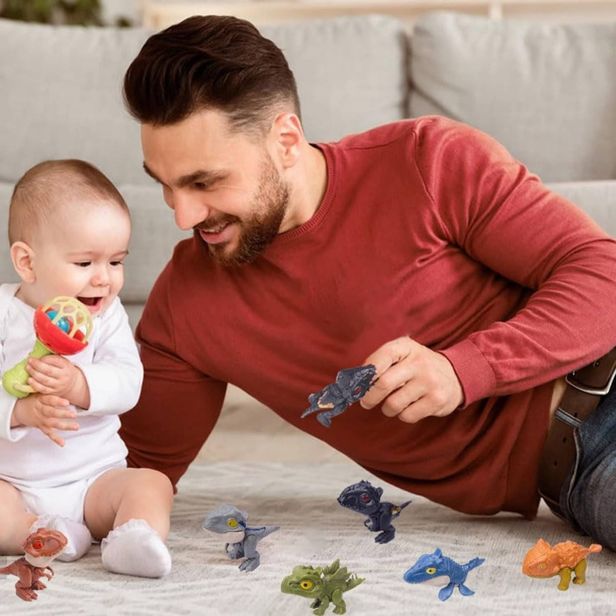 Parent and baby playing with small biting finger dinosaur toy figures