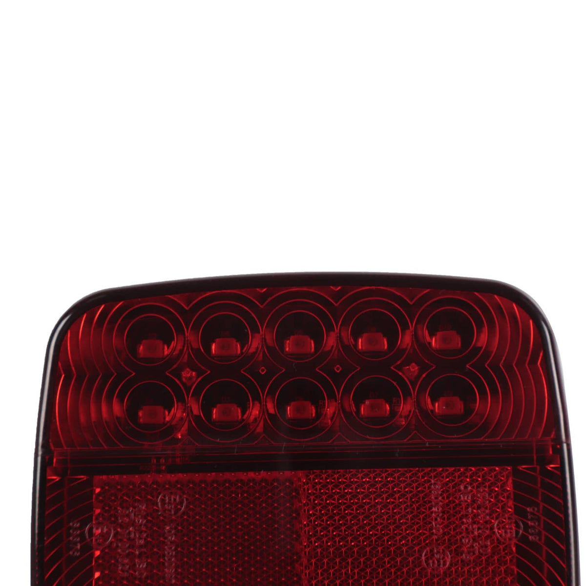 Close-up of red LED lens with circular light elements and grid texture