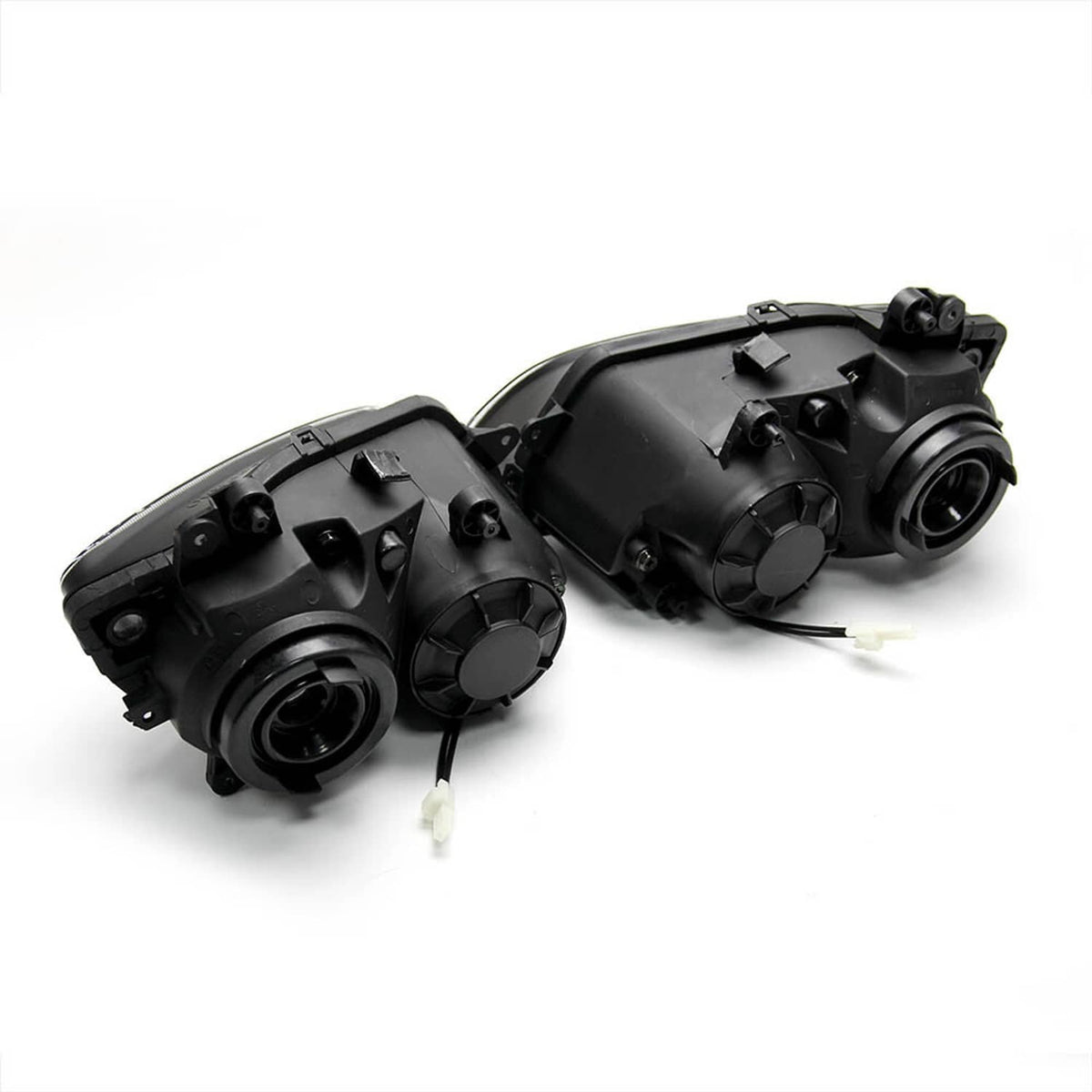 Rear view of dual headlight assemblies with wiring connectors