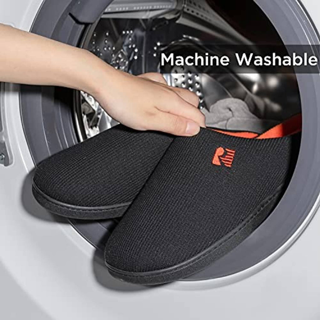 Black two-tone slip-on slippers with orange lining placed in a washing machine