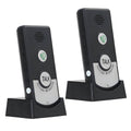 Black wireless intercom pager units with TALK button and speaker grille on charging stands