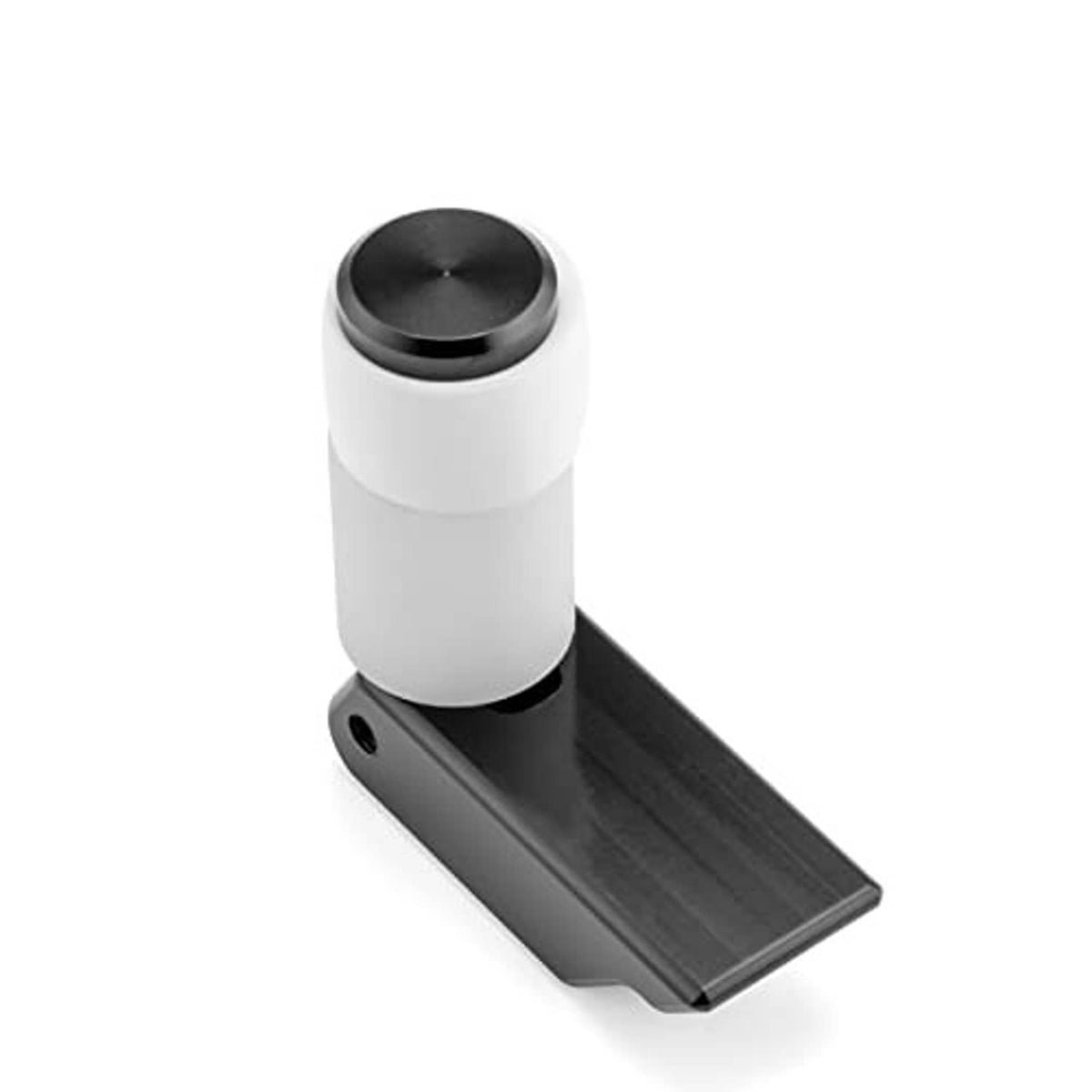Latch kit with white cylinder top and dark base plate with screw holes