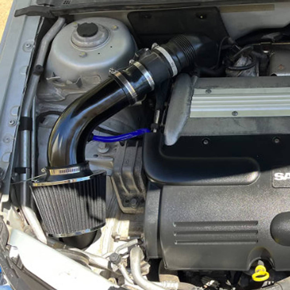 Installed cold air intake pipe and filter in engine bay with blue hose