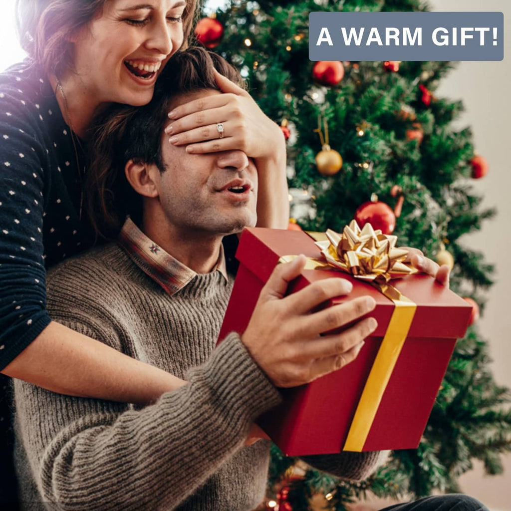 Holiday gift box with red wrapping and gold ribbon, warm present