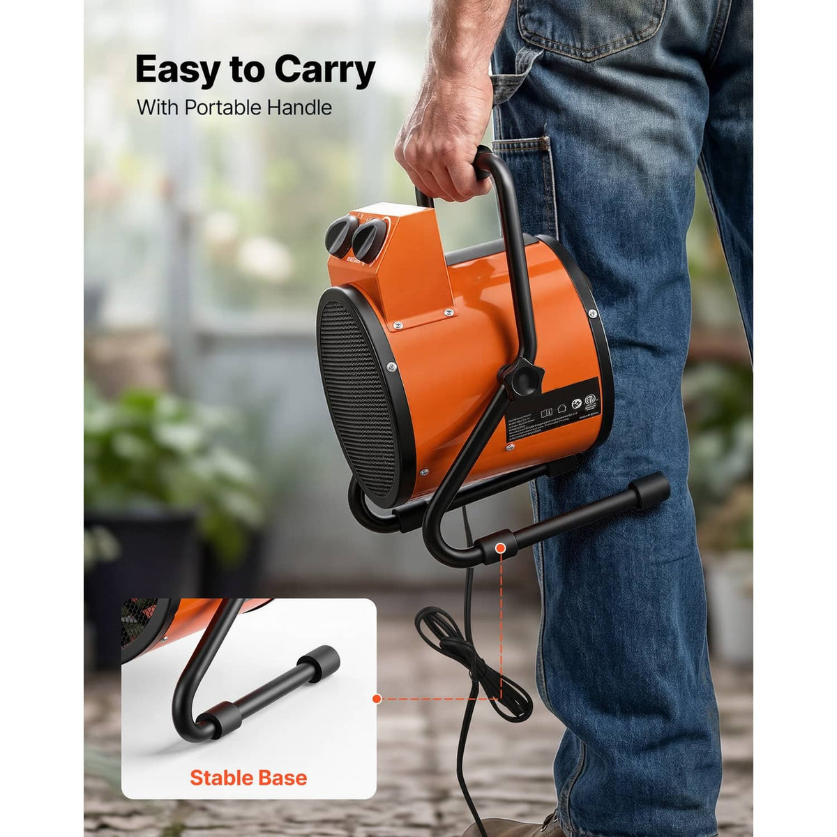 Orange portable electric greenhouse heater with carry handle held by person, stable black base