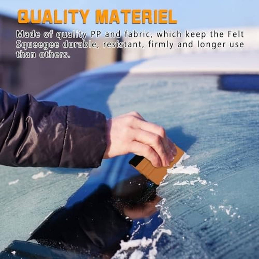 Vinyl squeegee with orange grip and black felt edge, applying film on a vehicle surface