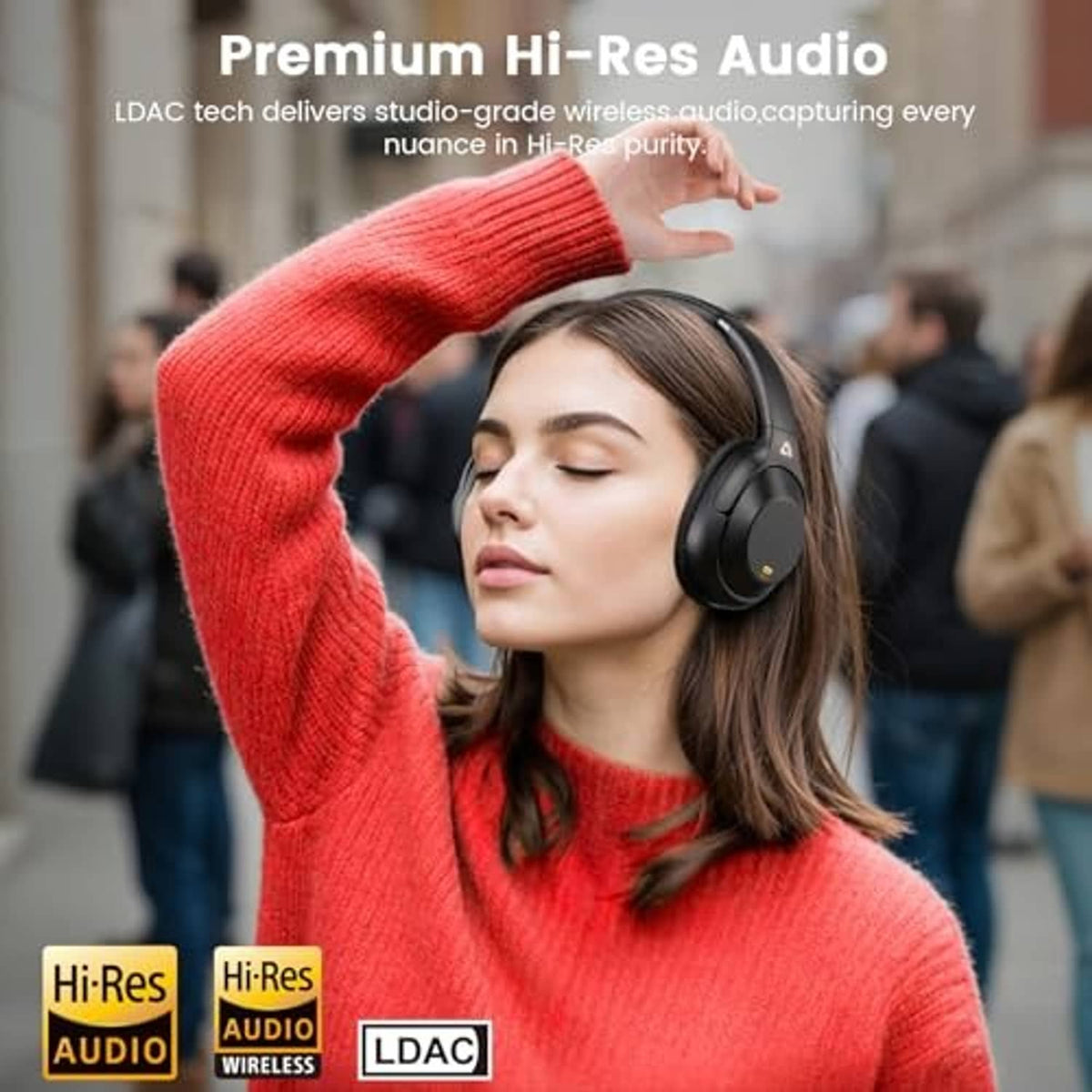 Over-ear headphones on a woman wearing a red sweater in an outdoor setting