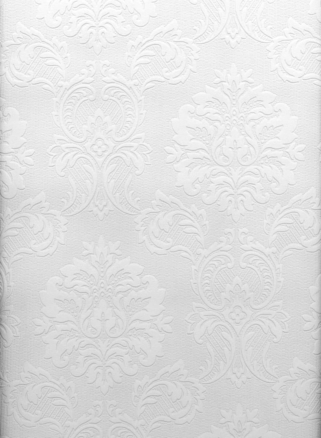 White paintable damask wallpaper, ornate embossed floral and scroll pattern close-up