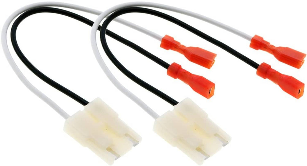 Pair of speaker wire connectors with white plugs, black wires, and orange terminals