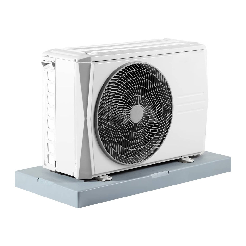 White mini split condenser sitting on a gray anti-vibration outdoor pad