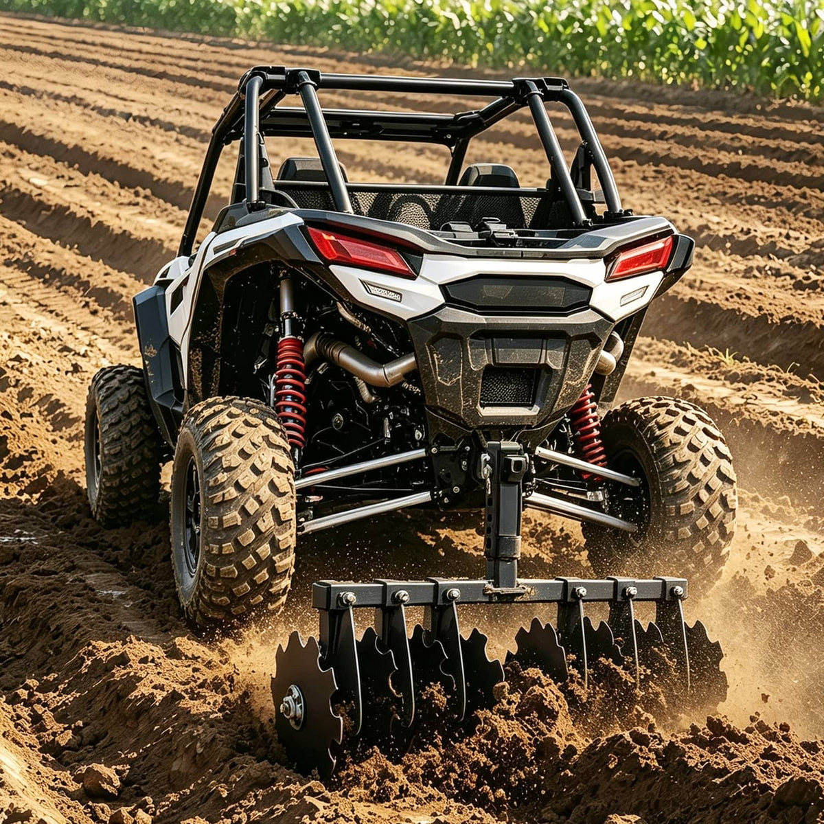 Front view receiver disc plow harrow with curved blades attached to a UTV