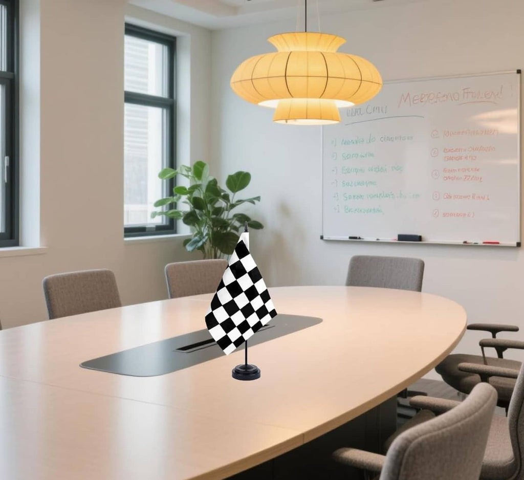 Black-and-white checkered racing flag on round base displayed on a table