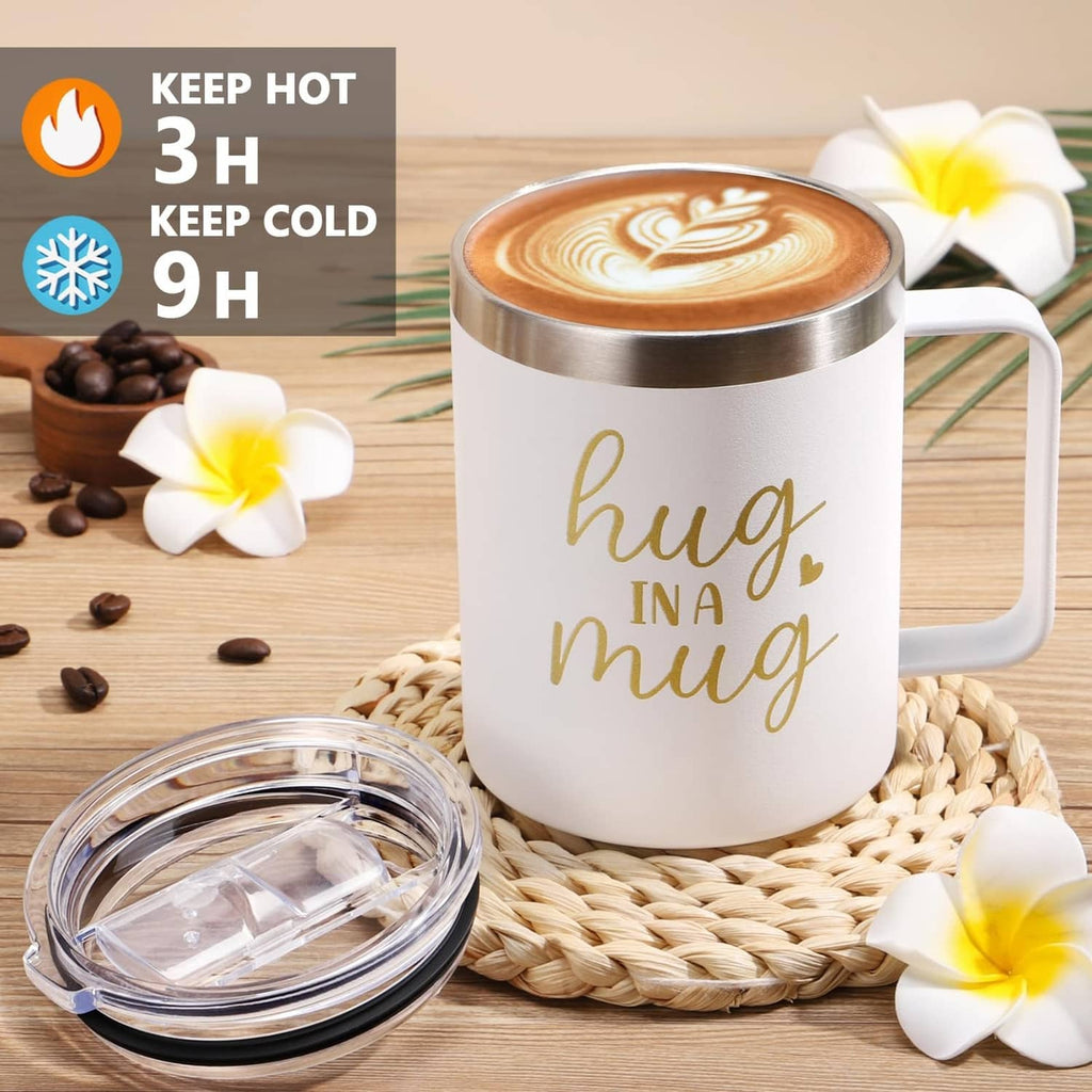 Insulated tumbler mug with 'hug in a mug' lettering on woven placemat