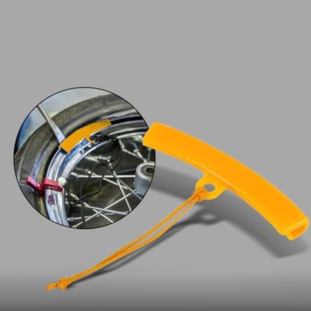 Orange tire rim protector guard used on a wheel, with cord lanyard