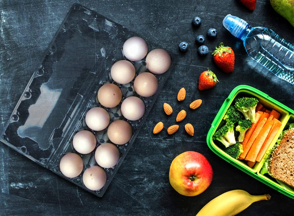 Clear plastic egg tray with compartments holding eggs